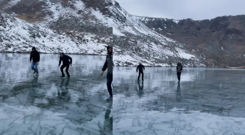 Artvinli gençler buz tutan Karagöl’de taş atıp test ettiler, sonra eğlendiler